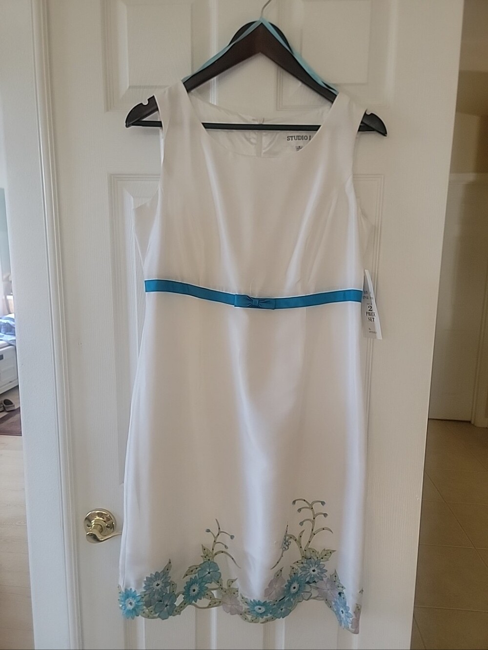 Studio 1, Sleeveless, scoop-neck empire waist sheath dress. 